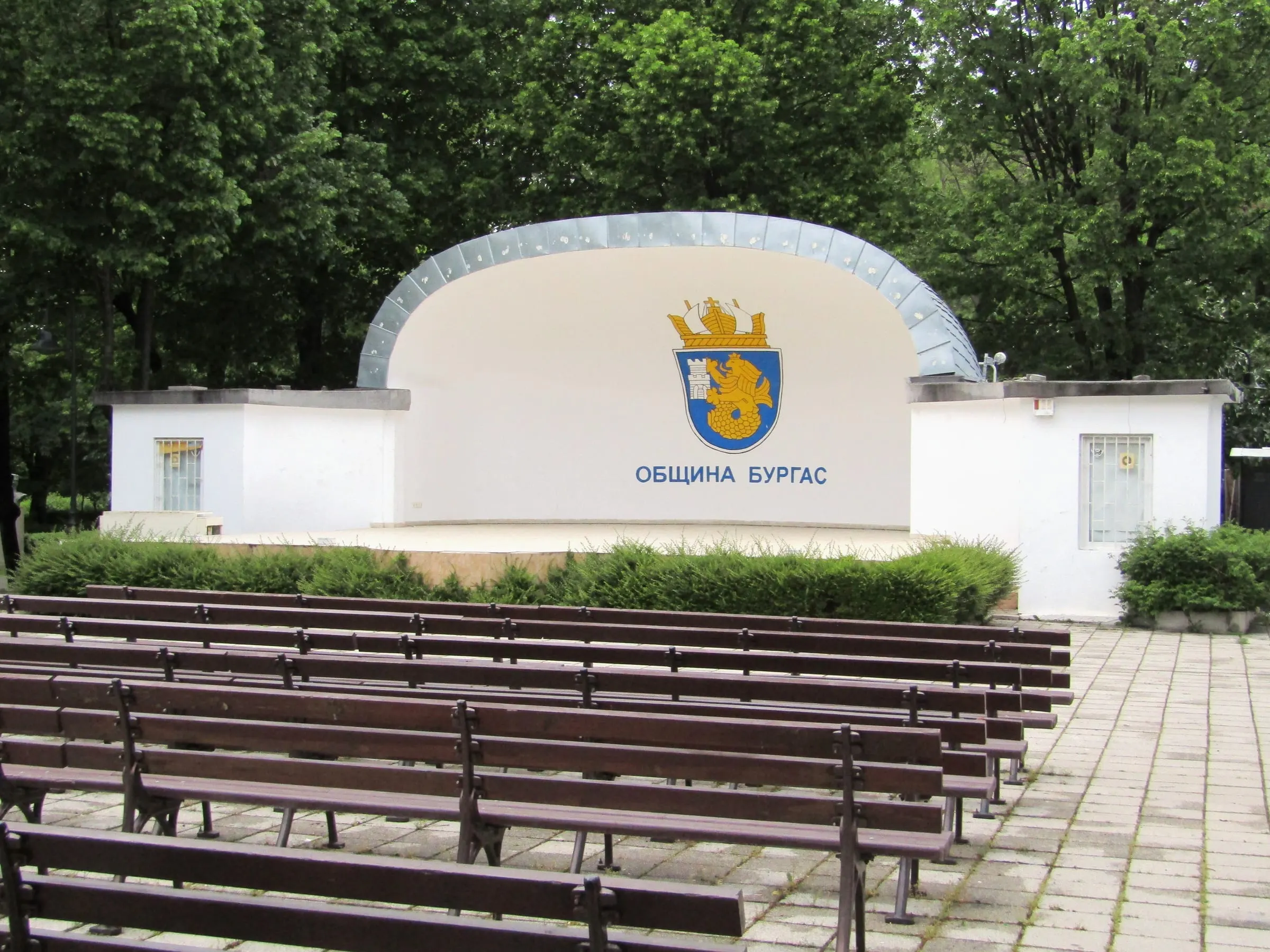 The open-air summer stage in Burgas's Sea Garden, with rows of wooden benches in front