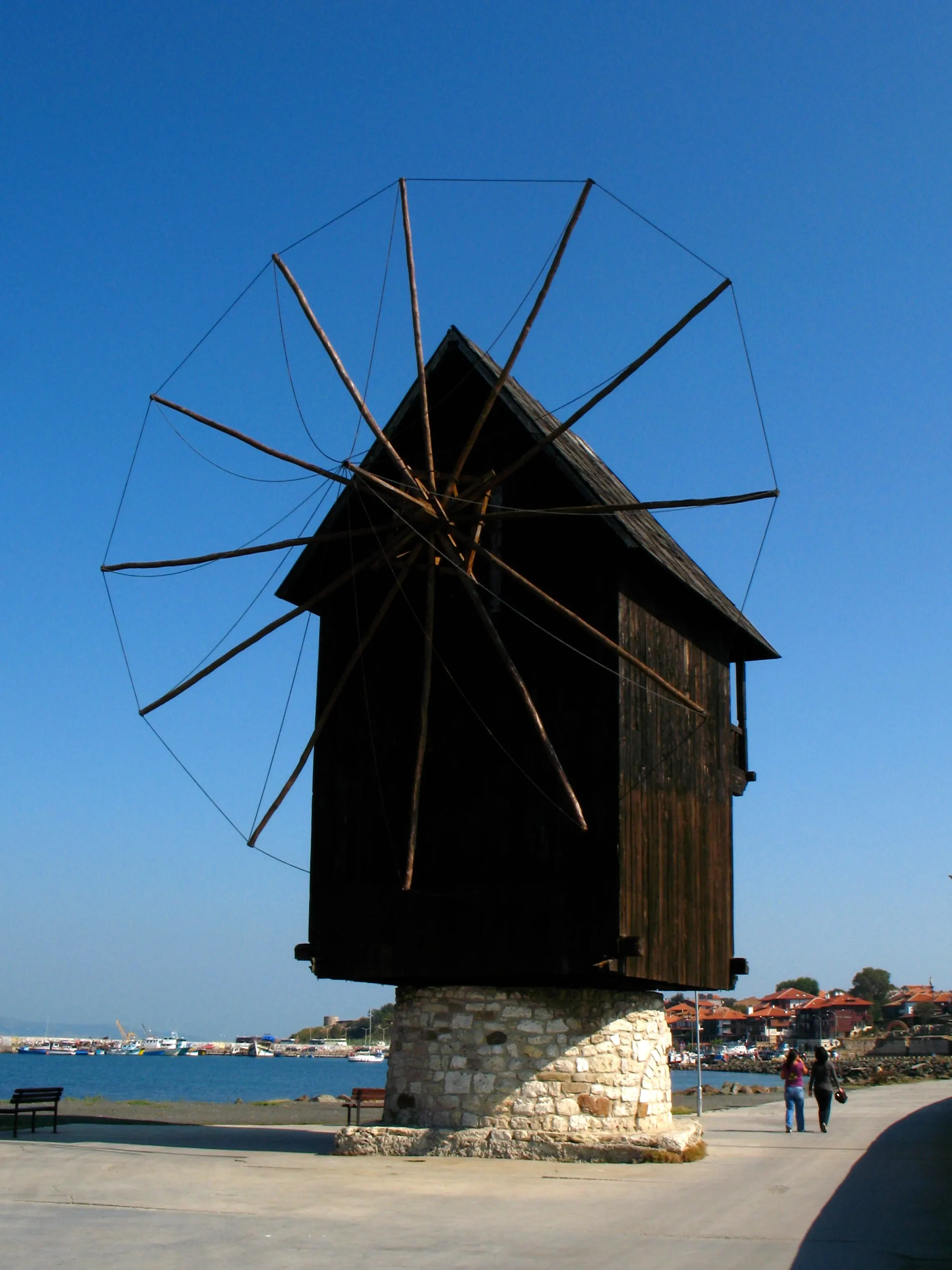 The wooden windmill standing on the causeway between Nessebar's new town and old town