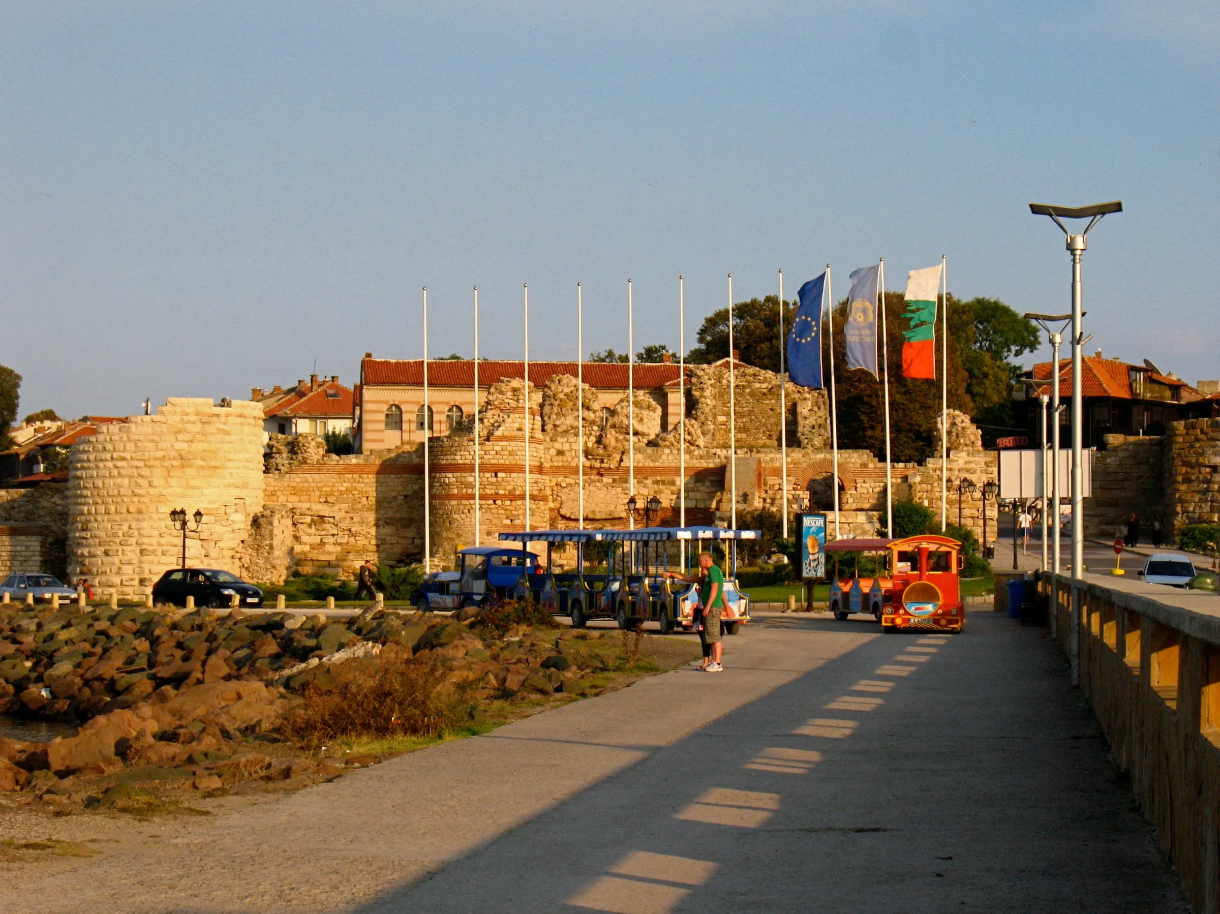 The fortification walls and gateway of Nessebar Old Town in low evening light